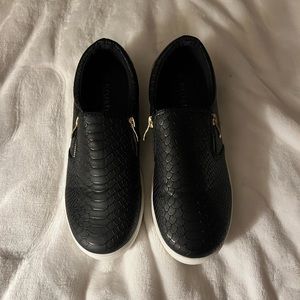 Black with gold zipper detail slip on faux alligator shoes